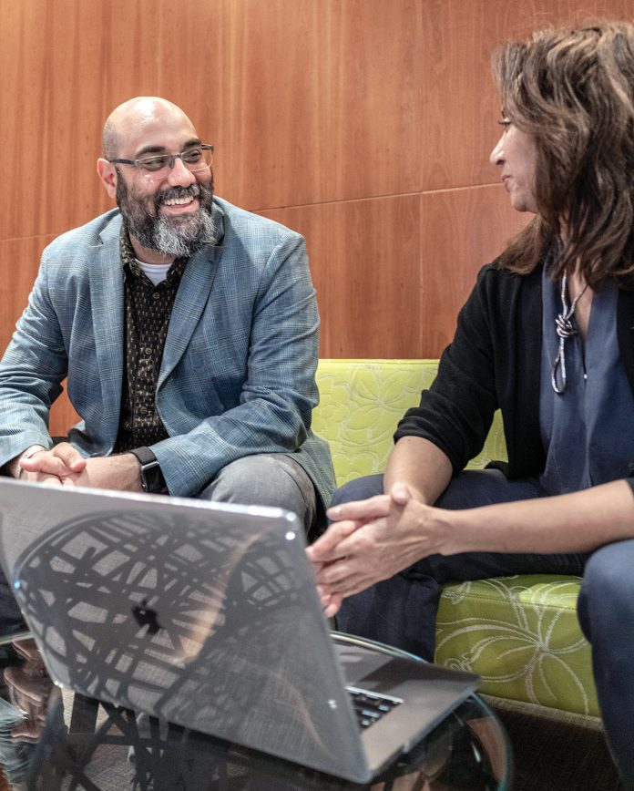 DEEPLY FOCUSED: Matthew Shenoda, social equity and inclusion vice president at Rhode Island School of Design, speaks with social equity inclusion fellow Rene Payne.
/ PBN PHOTO/MICHAEL SALERNO DEEPLY FOCUSED: Matthew Shenoda, social equity and inclusion vice president at Rhode Island School of Design, speaks with social equity inclusion fellow Rene Payne.
/ PBN PHOTO/MICHAEL SALERNO
