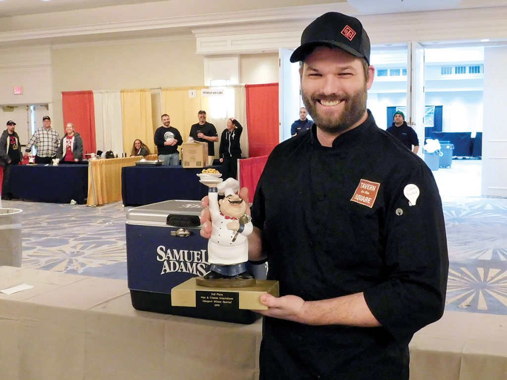 SAY CHEESE: Eric LeBlanc, a culinary operations leader at the new Tavern in the Square in Garden City in Cranston, celebrates his restaurant’s second-place finish in the Newport Winter Festival’s Mac and Cheese Smackdown held on Feb. 23.  / COURTESY NEWPORT WINTER FESTIVAL/BRITTANY ROSENBERG