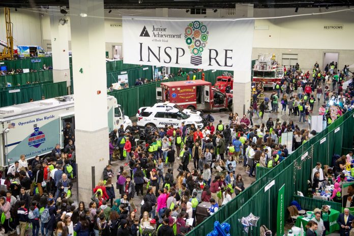 STUDENTS AND STAFF visit exhibits of businesses at the Junior Achievement of Rhode Island's JA Inspire Career Fair at the R.I. Convention Center in December 2018. / COURTESY JUNIOR ACHIEVEMENT OF RHODE ISLAND