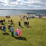 PEOPLE MAKE THEIR way to the water at Narragansett Bay to take a cold swim during the 2018 Project Sweet Peas Plunge for Preemies. This year's plunge will be held on March 9 at Warwick Country Club. / COURTESY PROJECT SWEET PEAS