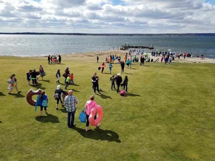 PEOPLE MAKE THEIR way to the water at Narragansett Bay to take a cold swim during the 2018 Project Sweet Peas Plunge for Preemies. This year's plunge will be held on March 9 at Warwick Country Club. / COURTESY PROJECT SWEET PEAS PEOPLE MAKE THEIR way to the water at Narragansett Bay to take a cold swim during the 2018 Project Sweet Peas Plunge for Preemies. This year's plunge will be held on March 9 at Warwick Country Club. / COURTESY PROJECT SWEET PEAS