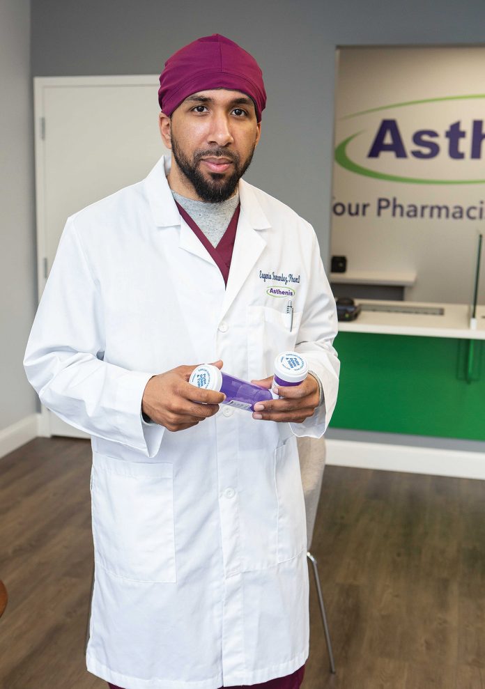 FINDING A NICHE: Eugenio ­Fernandez Jr. grew up in Providence’s West End and is now giving back through his independent pharmacy that serves a large Spanishspeaking population.  / PBN PHOTO/RUPERT WHITELEY