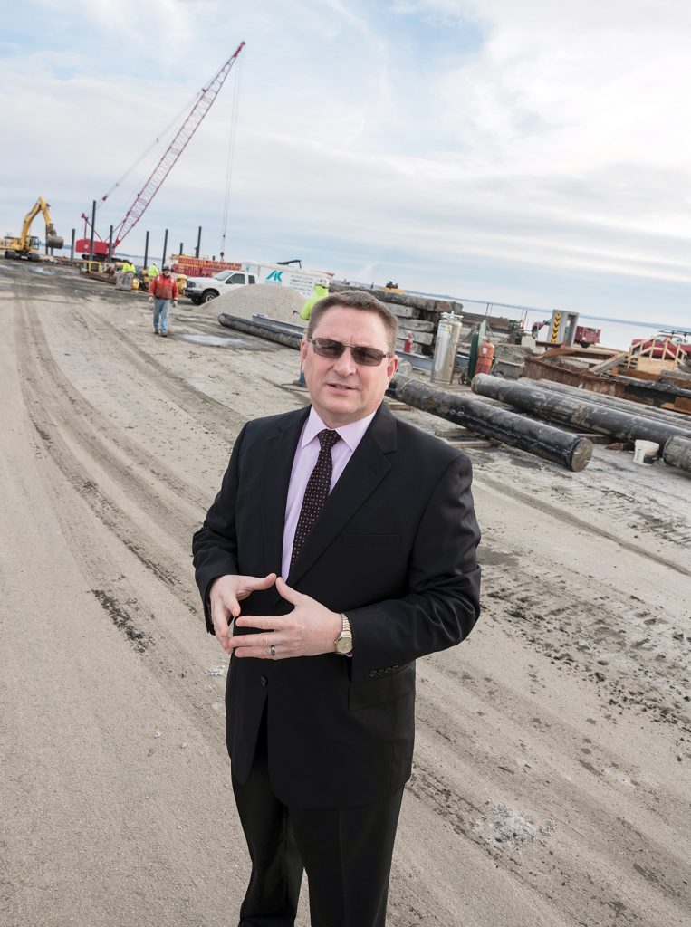 TERMINAL EXTENSION: Steven J. King, managing director of the Quonset Development Corp., stands in the area of a new terminal extension at the Port of Davisville at the Quonset Business Park in North Kingstown, part of a $90 million package of improvements at the port approved by voters in 2016.  / PBN PHOTO/MICHAEL SALERNO