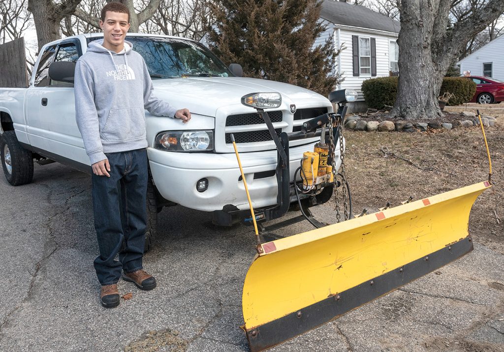 CLEAN LANDSCAPES: Sean Vann is a provider for Lawn Love, a new tech company that has expanded into Rhode Island and provides a platform that connects people who want their lawns and bushes trimmed in the summer and their driveways and walkways cleared of snow in the winter.  / PBN PHOTO/MICHAEL SALERNO