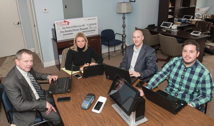 CARDS AND CAUSES: Swipe for a Cause, a company in North Kingstown that provides payment systems for debit and credit cards for other companies to use, takes a portion of the proceeds and donates them to charities. From left, Alan Kerr, vice president of strategic alliances; Kim Kennedy, account relationship manager; Jonathan Sayles, vice president of sales; and Brad Robinson, operations manager.
/ PBN PHOTO/MICHAEL SALERNO CARDS AND CAUSES: Swipe for a Cause, a company in North Kingstown that provides payment systems for debit and credit cards for other companies to use, takes a portion of the proceeds and donates them to charities. From left, Alan Kerr, vice president of strategic alliances; Kim Kennedy, account relationship manager; Jonathan Sayles, vice president of sales; and Brad Robinson, operations manager.
/ PBN PHOTO/MICHAEL SALERNO
