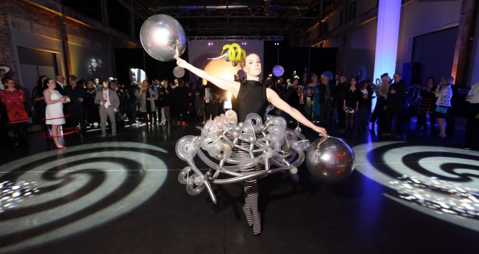 A DANCER FROM the Festival Ballet Providence School finishes a performance at last year's inaugural DesignxRI Designer's Ball. This year's event features a similar performance as part of a design and creative takeover of the Waterfire Arts Center on April 6. / COURTESY DESIGNXRI