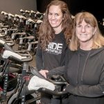 SPINNERS: Claire Hayes, left, and her mother, Sheila Hayes, are the franchise owners of Cyclebar in Smithfield. They opened the franchise after Claire began spinning classes while living in Massachusetts and spoke to her mom about opening a location in Rhode Island.  / PBN PHOTO/MICHAEL SALERNO