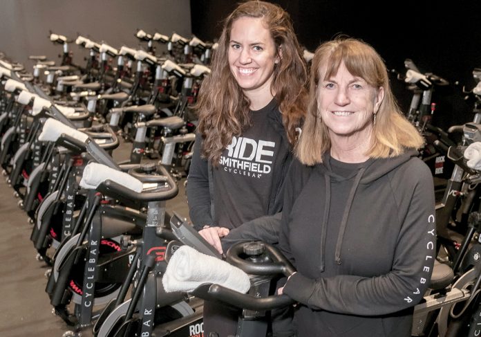 SPINNERS: Claire Hayes, left, and her mother, Sheila Hayes, are the franchise owners of Cyclebar in Smithfield. They opened the franchise after Claire began spinning classes while living in Massachusetts and spoke to her mom about opening a location in Rhode Island.
/ PBN PHOTO/MICHAEL SALERNO SPINNERS: Claire Hayes, left, and her mother, Sheila Hayes, are the franchise owners of Cyclebar in Smithfield. They opened the franchise after Claire began spinning classes while living in Massachusetts and spoke to her mom about opening a location in Rhode Island.
/ PBN PHOTO/MICHAEL SALERNO