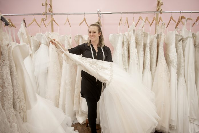 NEW OWNER: Kayla Thompson is the owner of Melissa Ashley Brides in Westerly. Thompson bought her wedding dress at the bridal shop seven years ago and befriended the former owner, Denise Pellegrino, who later hired Thompson. The pair came to a “personal finance agreement” that transitioned ownership to Thompson when Pellegrino was ready to sell.  / PBN PHOTO/DAVE HANSEN