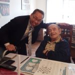 CRANSTON MAYOR Allan W. Fung, left, meets with Vincent DiPippo of Cranston after delivering food as part of Meals on Wheels of Rhode Island's March for Meals initiative. / COURTESY MEALS ON WHEELS OF RHODE ISLAND