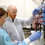 TEACHING TOOL: Megan Cortesi and Jeremy Demers, students in the process technician program at the Westerly Education Center, use a teaching tool that mimics industrial systems in the handling of liquids.  / PBN PHOTO/ BRIAN MCDONALD