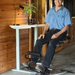 VERSATILE SEAT: Thomas E. Derecktor, founder and CEO of Derecktor Marine Technology LLC, sits on The Fehn, a chair he developed that uses movement to limit workday back pain and fatigue.  / COURTESY Derecktor Marine Technology LLC