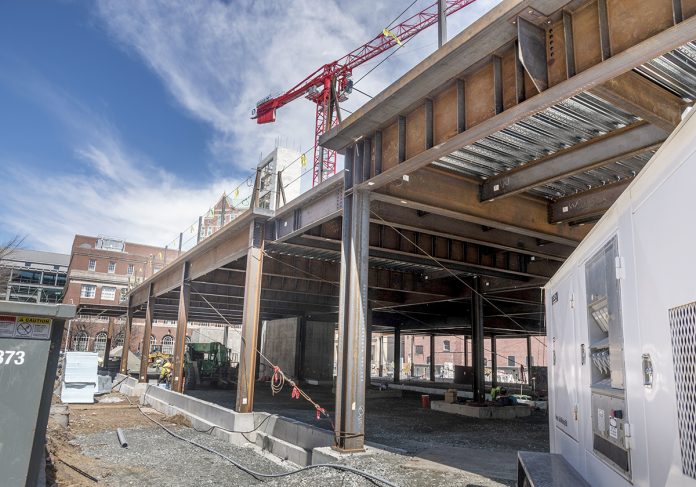 POTENTIAL GROCERY STORY: Pictured is the construction site of a six-floor housing project at 78 Fountain St. in Providence, where developers Cornish Associates and Nordblom Co. would like to see a grocery store occupy the ground floor.    / PBN PHOTO/MICHAEL SALERNO