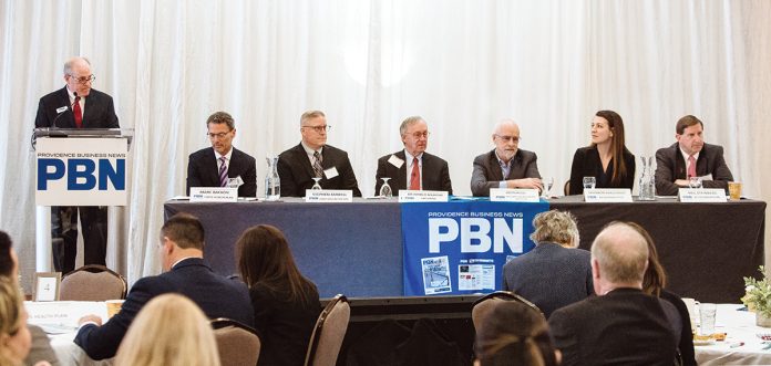 LISTEN AND LEARN: Participants during the first of two discussion panels at the 2019 PBN Spring Health Care Summit at the Providence Marriott talk about how the state’s health care and insurance systems must listen to and understand the whole person they purport to serve. From left: Marc Backon, president of Tufts Health Plan’s commercial division; Stephen Farrell, UnitedHealthcare of New England CEO; Dr. John Murphy, executive vice president of physician affairs at Lifespan; James E. Purcell, former CEO of Blue Cross & Blue Shield of Rhode Island and founder of the Returns on Wellbeing Institute; Shannon Shallcross, co-founder and CEO of BetaXAnalytics; and Neil D. Steinberg, president and CEO of the Rhode Island Foundation.  / PBN PHOTO/RUPERT WHITELEY