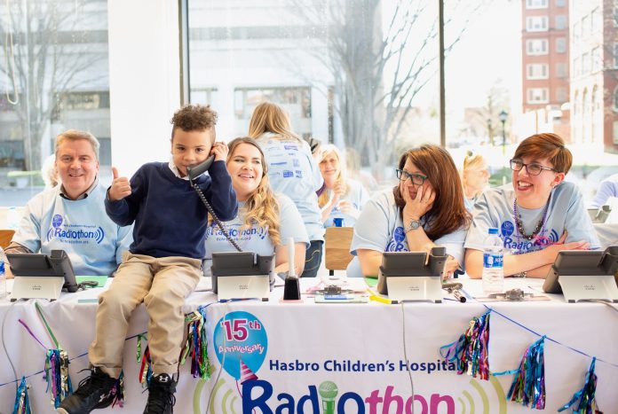 Radiothon AFTER GOING ON-AIR with his mother to share his story as a Hasbro Children’s Hospital, 7-year-old Kai Vitolo joined volunteers at the phone bank to take calls from donors during the hospital's annual radiothon last Thursday. / COURTESY HASBRO CHILDREN'S HOSPITAL.