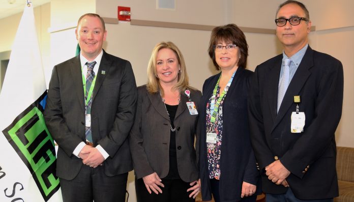 SOUTHCOAST HEALTH celebrates organ donors on April 3. From left, Craig Tucker of New England Donor Services; Renee Clark, chief operating officer of Southcoast Health; Sue Graham, guest speaker, who is also on the kidney donation waiting list; and Dr. Naresh Mansharamani of Southcoast Pulmonary Medicine. / COURTESY SOUTHCOAST HEALTH