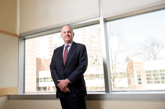 BIGGER IMPACT: Dr. Timothy J. Babineau, a former cancer surgeon, said he used to care for patients one at a time, but now as president and CEO of Lifespan, “I take care of them 10,000 at a time.”  / PBN PHOTO/DAVE HANSEN