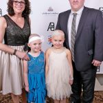WISH GALA: Emma Zielinski, second from left, and Wish Kid Ella Watters, third from left, pose for a photo with Ella’s father, Michael Watters, right, and Ella’s mother, Tracy Watters, left, at last year’s Children’s Wishes Passport Gala. This year’s gala, where Emma Zielinski will receive the 2019 Journey Award, will be held on May 10 at Twin River Casino Hotel in Lincoln.  / COURTESY DENNIS FORD
