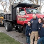 SMOOTHING THE WAY: Jason and Justyne Johnson, pictured with their son Tristan, started Statewide Paving and Patching in Warwick in October.    / PBN PHOTO/MICHAEL SALERNO