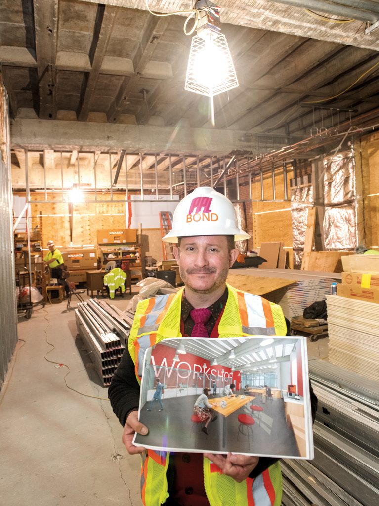 WORKSHOP ROOM: The Providence Public Library is undergoing a $25 million renovation to transform the Empire Street wing that was built in 1953. Pictured, Executive Director Jack Martin walks through what will be the 3,000-square-foot workshop room on the ground floor.  / PBN PHOTO/DAVE HANSEN