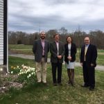REPRESENTATIVES OF BAYCOAST BANK and the Westport Land Conservation Trust at the former St. Vincent de Paul Camp. From left, Ross Moran, executive director of the Westport Land Conservation Trust; Trip Millikin, WLCT board president; Betty-Ann Mullins, BayCoast Bank senior vice president; and Richard De Almeida, BayCoast Bank vice president and loan officer./ COURTESY BAYCOAST BANK