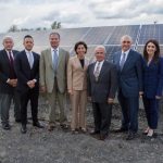 SOUTHERN SKY RENEWABLE ENERGY RHODE ISLAND has been sued by Southern Sky Renewable Energy in federal court. From left, North Providence Chief of Staff Richard Fossa; North Providence Town Council President Dino Autiello; Senate President Dominick J. Ruggerio; Gov. Gina M. Raimondo; North Providence Mayor Charles Lombardi; Southern Sky President Ralph A. Palumbo and Southern Sky Vice President Lindsay McGovern in front of a Southern Sky Renewable Energy Rhode Island solar array in North Providence in October. / COURTESY SOUTHERN SKY RENEWABLE ENERGY RHODE ISLAND