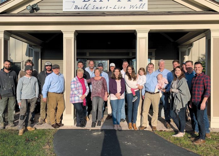 THANKFUL TEAM: The staff at Davitt gathers for the company’s Thanksgiving celebration in November 2018 at the office in South Kingstown.   / COURTESY DAVITT DESIGN BUILD