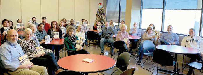 AVID READERS: EMC Insurance’s “book club” marks the completion of reading “QBQ,” a book on practicing personal accountability.  / COURTESY EMC INSURANCE COS.