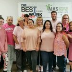 MEETING THEIR MATCH: Staff members at MAS Medical Staffing dress in pink as part of Breast Cancer Awareness Month in October.  / COURTESY MAS MEDICAL STAFFING