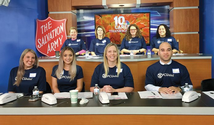 AT THE READY: A team of Pawtucket Credit Union employees staffs the phones during a Salvation Army and WJAR-TV NBC 10 fundraiser on Thanksgiving.  / COURTESY PAWTUCKET CREDIT UNION