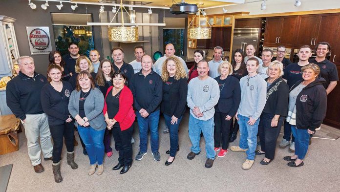 SHOWING THEIR PRIDE: Members of Rhode Island Kitchen & Bath’s design and build teams at the company showroom in Warwick.   / COURTESY RHODE ISLAND KITCHEN & BATH