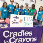 WRITE ON: Staff members at CBIZ & MHM lend a hand to the nonprofit Cradles to Crayons on CPA Day.  / COURTESY CBIZ & MHM