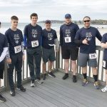 IN THE RUNNING: Compass IT workers participate in the R.I. State Police’s “5K Foot Pursuit” in April.  / COURTESY COMPASS IT COMPLIANCE