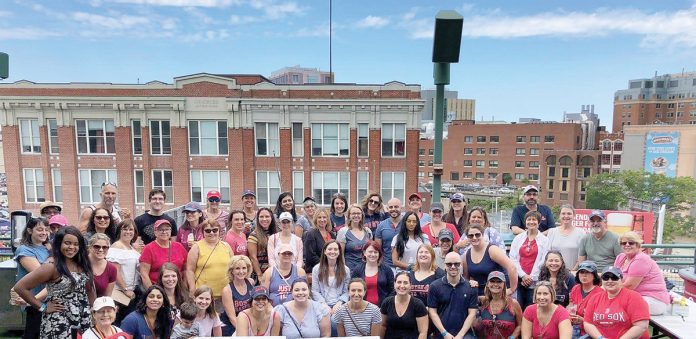 OUT TO THE BALLGAME: Healthcentric staff members gather for a barbeque and a Red Sox game at Fenway Park in 2018.  / COURTESY HEALTHCENTRIC ADVISORS