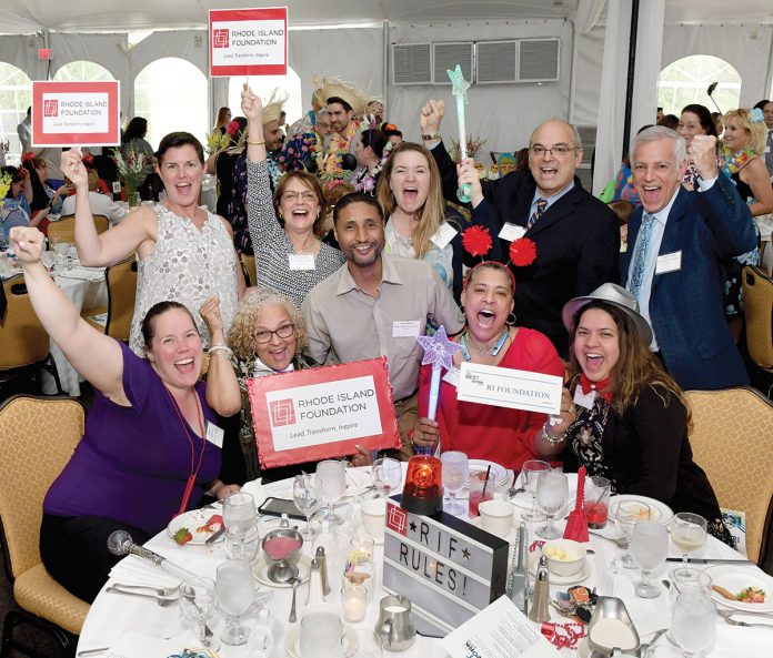 CHARGED UP: Some of the Rhode Island Foundation staff celebrate at last year’s awards dinner for PBN’s Best Places to Work winners.  / COURTESY RHODE ISLAND FOUNDATION