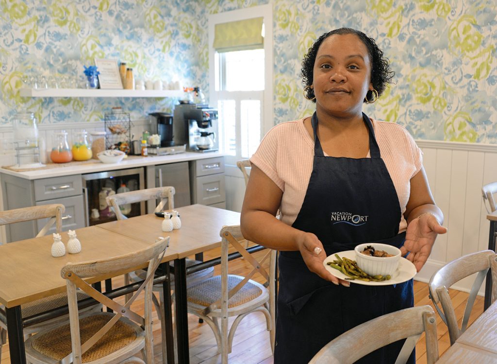 TOWN & TIDE: Shawna Weeden is the assistant innkeeper at Town & Tide Inn in Newport, one of six boutique hotel properties in the city owned by Christopher Bicho, who said many of his hotel rooms will go for $600 a night on weekends in peak season.  / PBN PHOTO/ELIZABETH GRAHAM