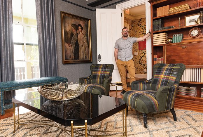 RENOVATED MANOR: Will Bradfield is the co-general manager at the 16-room Cliffside Inn in Newport that underwent a renovation earlier this year. The painting at left is by Beatrice Turner, who summered at the manor from 1907-1948.  / PBN PHOTO/DAVE HANSEN