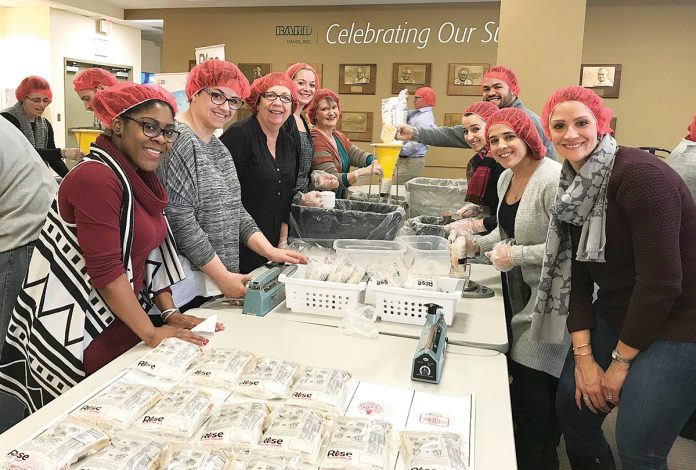 A BIG HELPING: Employees of Becton, Dickinson and Co. in Warwick help package 25,000 meal packets in support of Rise Against Hunger. x / Lists: Best Places to Work - Enterprise