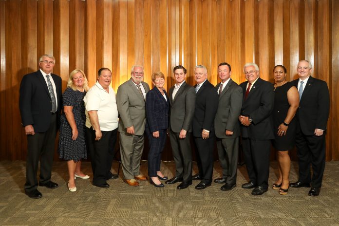 THE SOUTHCOAST and Bristol County chambers of commerce have voted to merge into a yet-to-be-named nonprofit entity. Above, members of the integration task force. From left: Bill Perkins; Catherine Dillon; Douglas Rodrigues; Rick Kidder, CEO of the SouthCoast Chamber; Kim Perry; Brian LeComte; Michael O'Sullivan, CEO of the Bristol County Chamber; Curt Nelson; Carl Sawejko; Rose Lopes; and Ron Ellis. / COURTESY SOUTHCOAST CHAMBER OF COMMERCE AND BRISTOL COUNTY CHAMBER OF COMMERCE