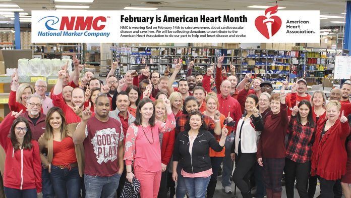 PUMPED: Employees at National Marker wear red after collecting donations for the American Heart Association in February.  / COURTESY NATIONAL MARKER