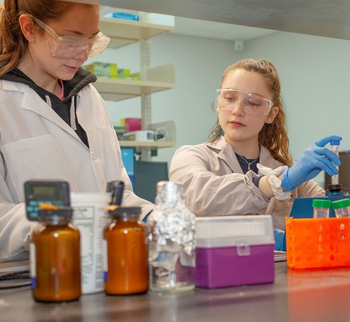 SALVE REGINA UNIVERITY students Caroline McNeil, left, and Lindsay Wright work in Assistant Professor Heather Axen's lab at Salve's Department of Biology and Biomedical Sciences./COURTESY SALVE REGINA UNIVERSITY