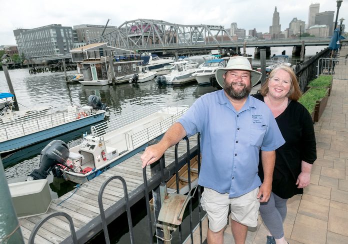 DRAMATIC CHANGE: Tom McGinn, captain and president, and Kristin Stone are co-owners of Providence Riverboat. After the company joined the Providence Warwick Convention & Visitors Bureau, it shifted its business model from cocktail cruises to catering to the tourism industry and nearly tripled its revenue in the first year, Stone said.  / PBN PHOTO/MICHAEL SALERNO