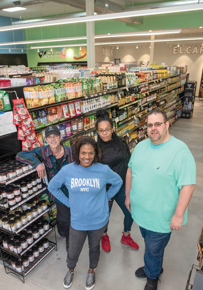 FOOD CO-OP: From left, Erb Reinert, bulk and wellness buyer; Jacqueline Sophia, finance manager; Leah Costa, customer service manager; and Jesse Cardarelli, produce manager, are pictured at the newly opened Urban Greens Co-op Market in Providence.  / PBN PHOTO/MICHAEL SALERNO