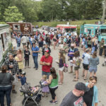 NEWPORT has voted to grant permits to food trucks and carts. Above, a crowd gathers at a Friday night food truck gathering at Roger Williams Park in Providence in 2016. / PBN FILE PHOTO/ MICHAEL SALERNO