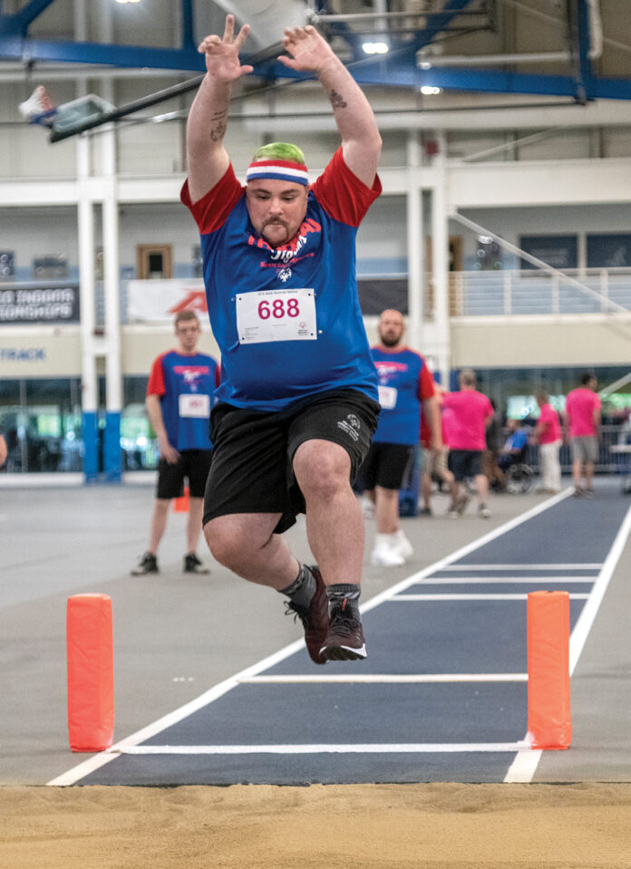BIG LEAP: Andrew ­Palumbo of Warwick competes in the long jump for the Trudeau Tigers, at the Special Olympics Rhode Island Summer Games earlier this year.  / PBN PHOTO/MICHAEL SALERNO