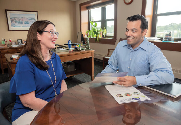 ADDED BENEFIT: Jacques Afonso, manager of community and customer management with National Grid Rhode Island, speaks with Jennifer Bray, senior program manager for corporate communications. Afonso has taken advantage of National Grid’s partial student-loan repayment benefit to help pay back $60,000 in loans after graduating from Suffolk University in 2009.
/ PBN PHOTO/MICHAEL SALERNO ADDED BENEFIT: Jacques Afonso, manager of community and customer management with National Grid Rhode Island, speaks with Jennifer Bray, senior program manager for corporate communications. Afonso has taken advantage of National Grid’s partial student-loan repayment benefit to help pay back $60,000 in loans after graduating from Suffolk University in 2009.
/ PBN PHOTO/MICHAEL SALERNO