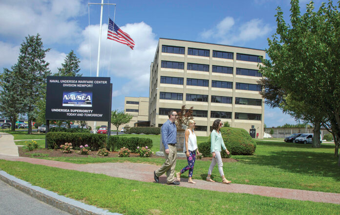 INCREASED WORKFORCE: From left, Justin Monte, Suzanne Violet and Kate Arsenault walk along the Naval Undersea Warfare Center Division Newport campus. The workforce at the 180-acre, 76-building complex mainly consists of highly paid professionals such as engineers and scientists, administrators and technicians. The workforce has grown by more than 200 employees to between 6,100 and 6,200 since last fall, 4,500 of whom live in Rhode Island.  / COURTESY NAVAL UNDERSEA WARFARE CENTER DIVISION NEWPORT