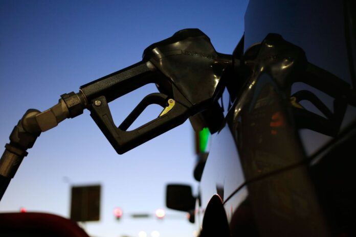 THE AVERAGE price of regular gas in Rhode Island declined 2 cents this week to $2.71 per gallon. / BLOOMBERG NEWS FILE PHOTO/ LUKE SHARRETT