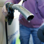 THE AVERAGE PRICE of regular gas in Rhode Island declined 5 cents this week. / BLOOMBERG FILE PHOTO/PAUL THOMAS
