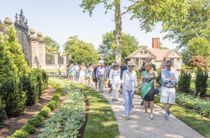 PRESERVATION SOCIETY OF NEWPORT COUNTY CEO and Executive Director Trudy Coxe, center, walks along the restored serpentine path at the Breakers with Hope 